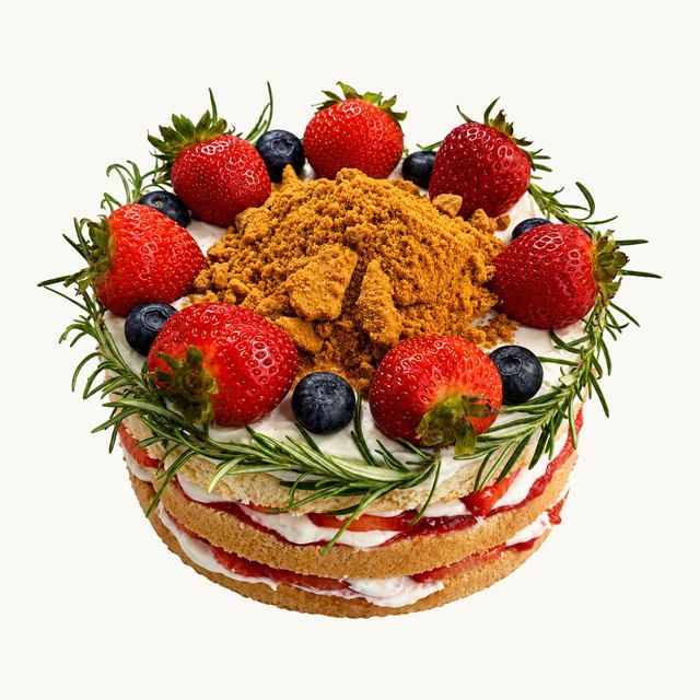 Fresh Strawberry Cake with strawberries, blueberries and rosemary