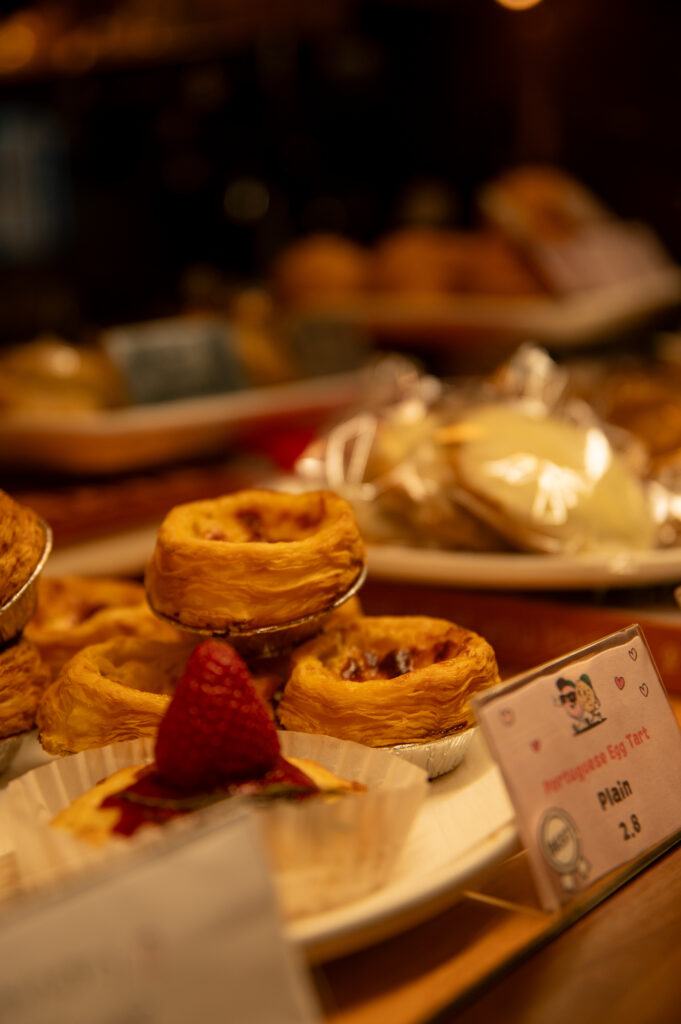 Egg tarts and pastries in the CozyHaus pastry case